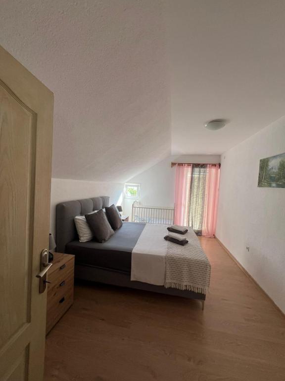 Postel nebo postele na pokoji v ubytování Apartman Nina2