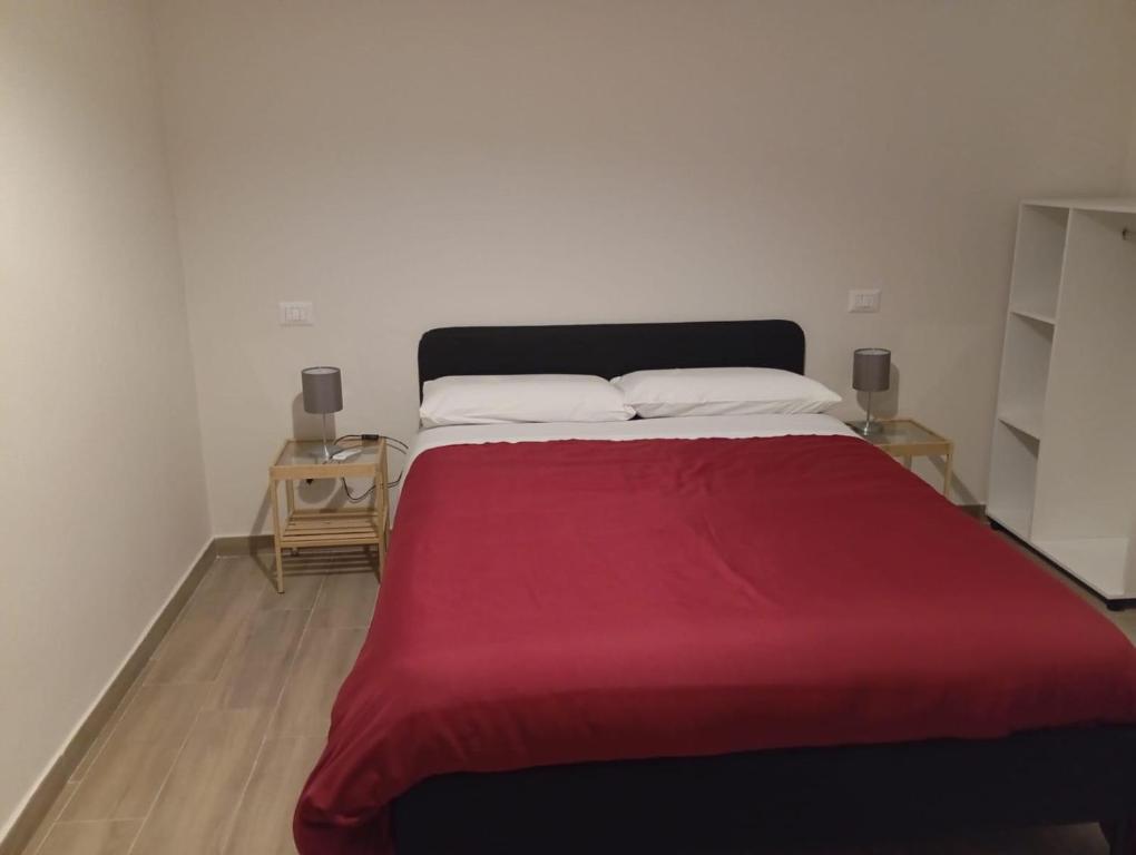 A bed or beds in a room at Affittacamere Iria