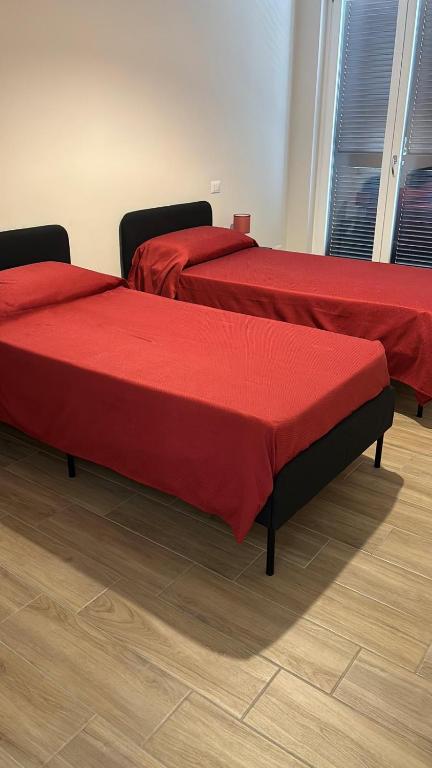 A bed or beds in a room at Affittacamere Iria