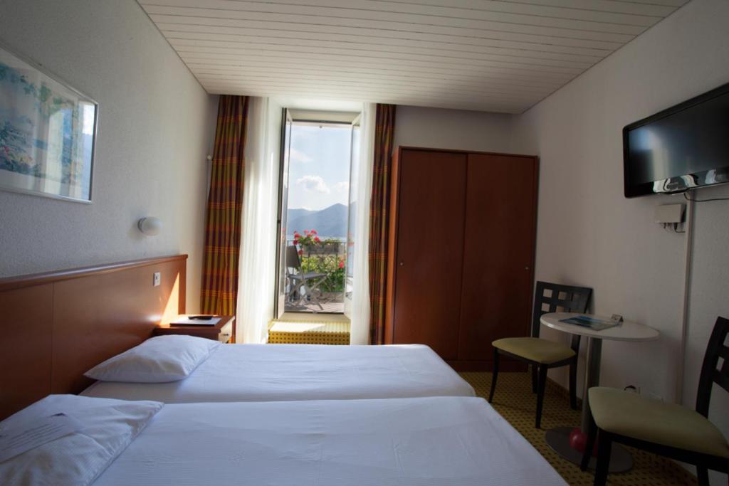 Postel nebo postele na pokoji v ubytování Piazza Ascona Hotel & Restaurants