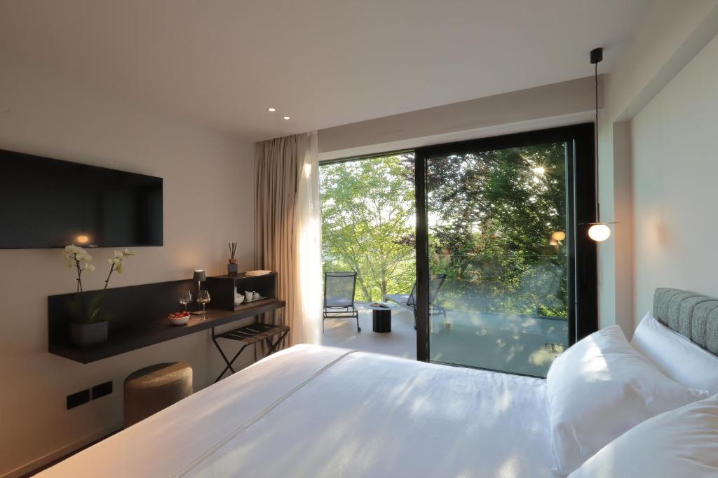 Ένα ή περισσότερα κρεβάτια σε δωμάτιο στο Azienda Agricola Galliussi