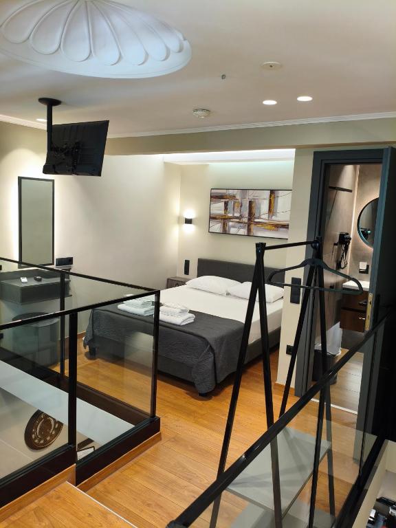 Ένα ή περισσότερα κρεβάτια σε δωμάτιο στο NK Loft