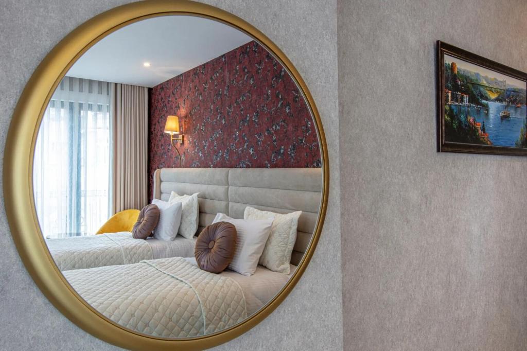 A bed or beds in a room at Hotel Real Life