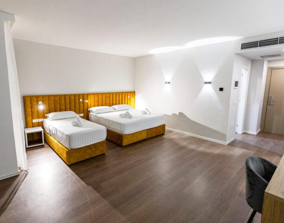 Postel nebo postele na pokoji v ubytování Ajsel Hotel