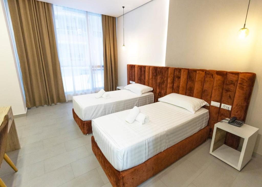 Postel nebo postele na pokoji v ubytování Ajsel Hotel