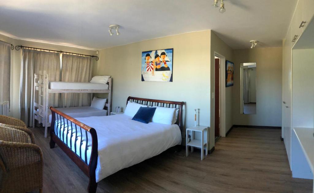Postel nebo postele na pokoji v ubytování Dune Lodge