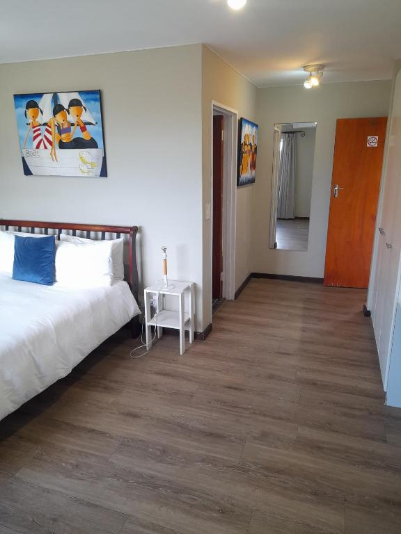 Postel nebo postele na pokoji v ubytování Dune Lodge