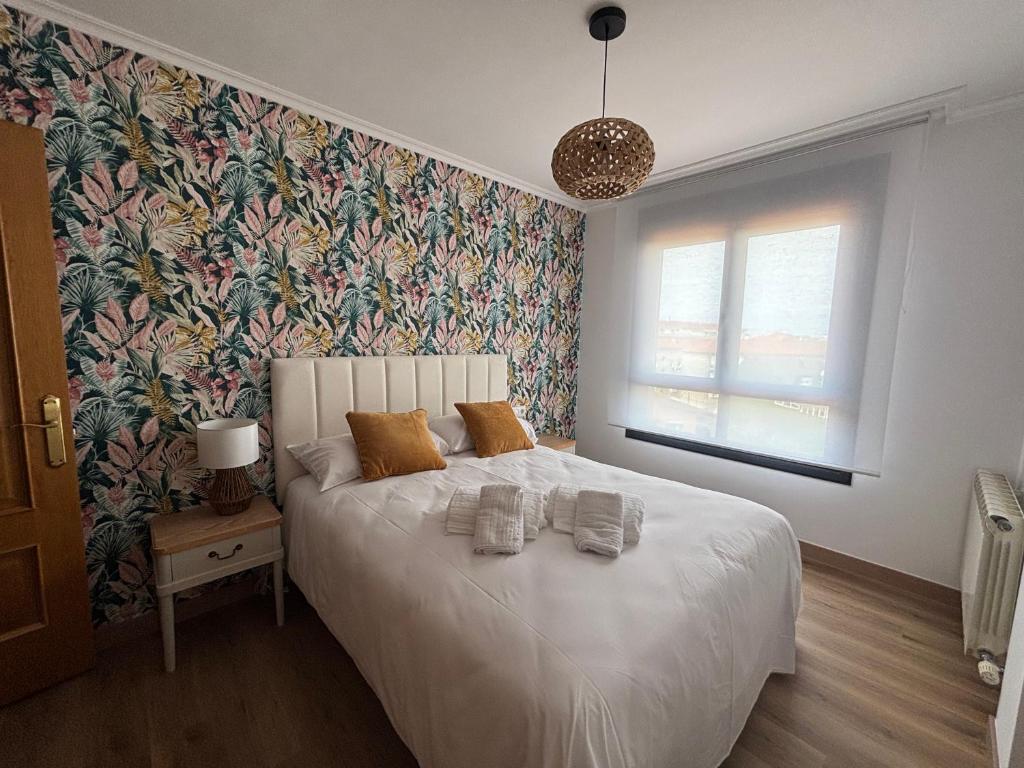 En eller flere senge i et værelse på Ático Arousa Luxe stay