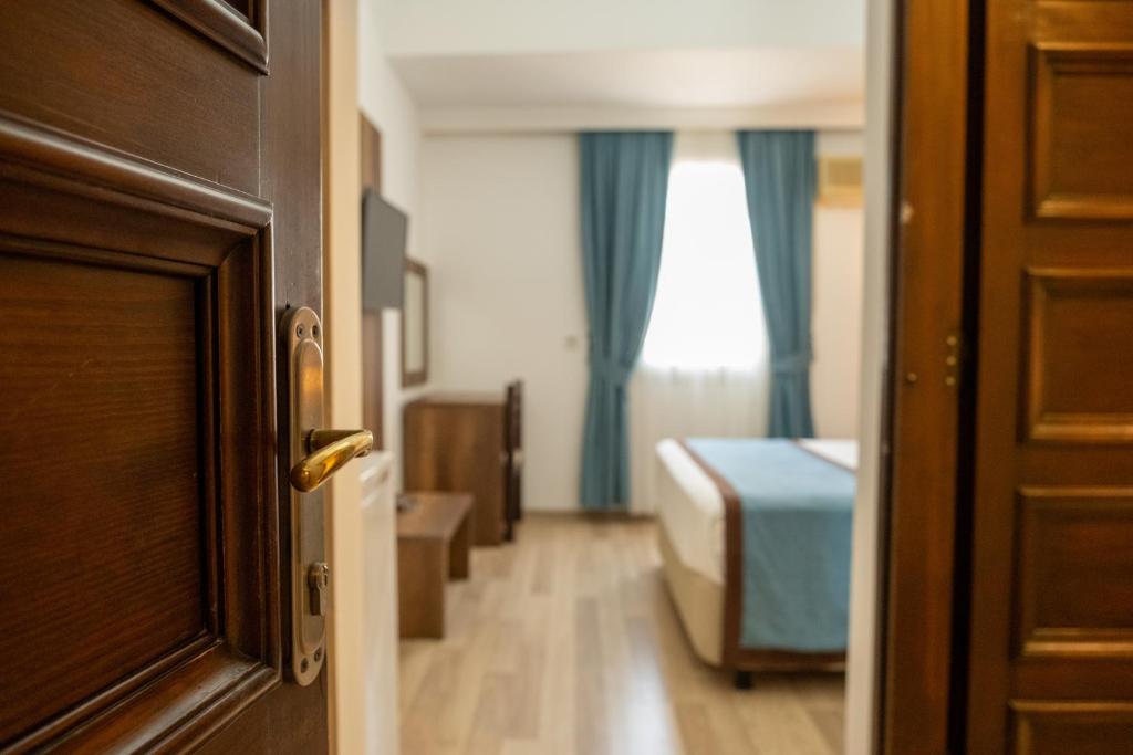 Postel nebo postele na pokoji v ubytování Dinc Pension