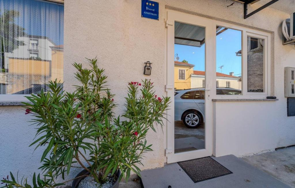 a car is parked outside of a building at Apartman Cukar Pula in Pula