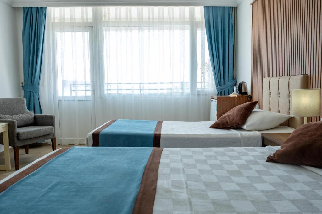 Postel nebo postele na pokoji v ubytování Dinc Pension