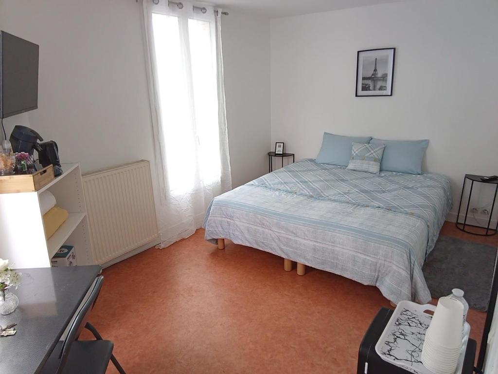 Postel nebo postele na pokoji v ubytování Chambre privée a Arcueil - Cachan