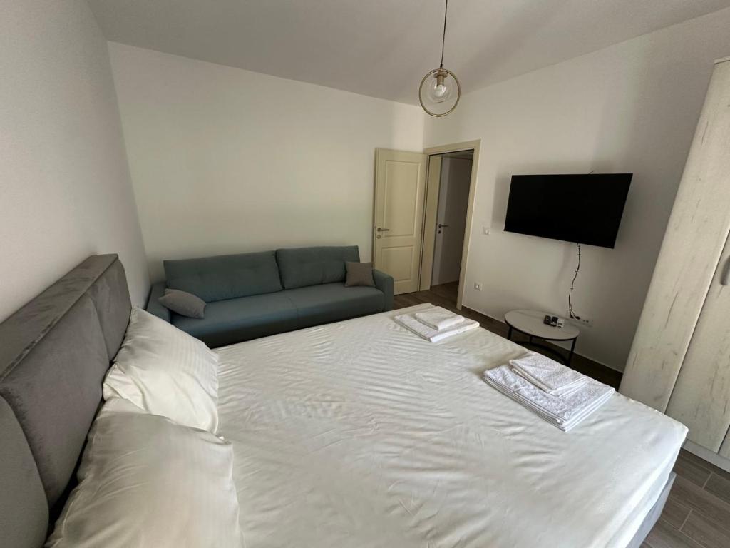 Postel nebo postele na pokoji v ubytování Apartmani Aki 4