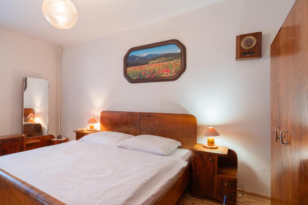 Postel nebo postele na pokoji v ubytování Holiday House Mária