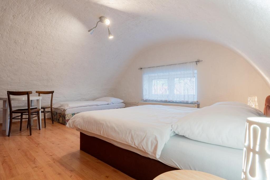 Postel nebo postele na pokoji v ubytování Holiday House Mária