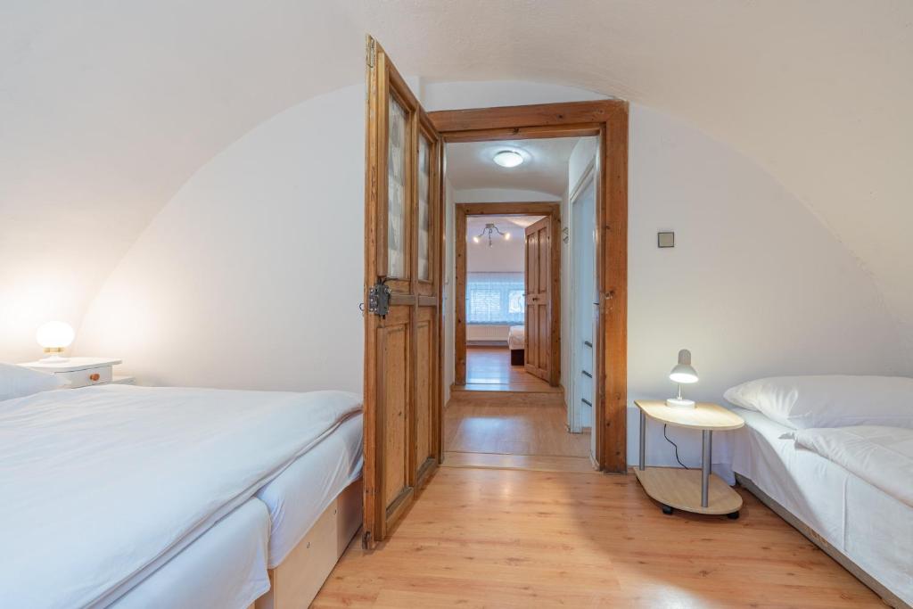 Postel nebo postele na pokoji v ubytování Holiday House Mária