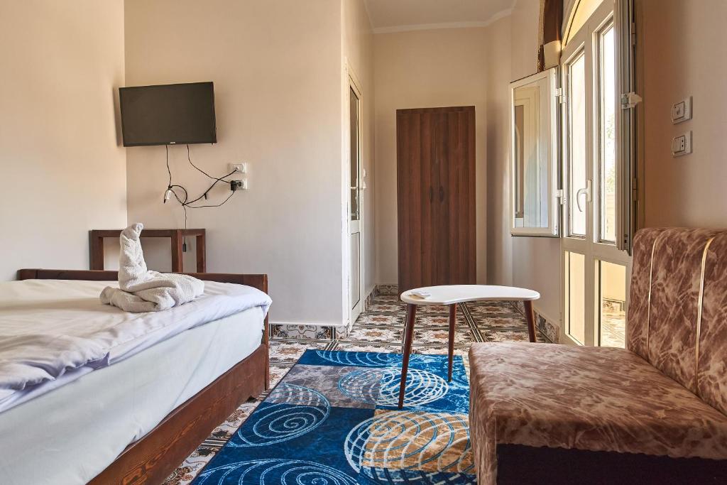 Postel nebo postele na pokoji v ubytování Sunset Guest house