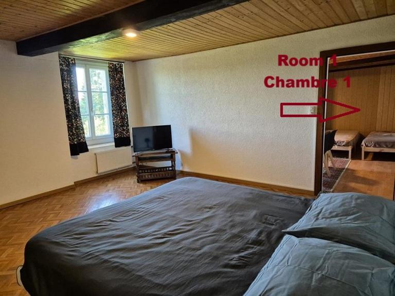 En eller flere senger på et rom på Chambre d'Hôtes R&S