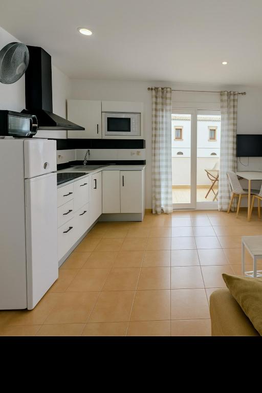 Kuchyň nebo kuchyňský kout v ubytování Conil terraza apartamentos