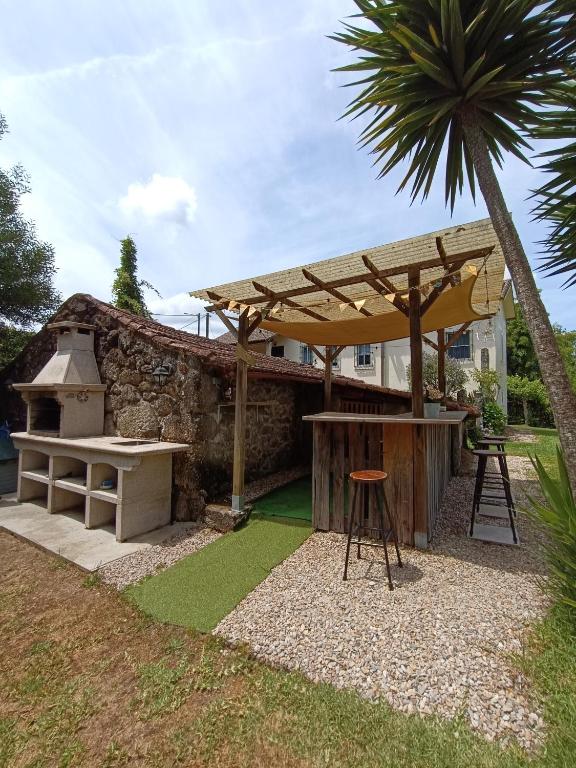 Vonkajšia záhrada v ubytovaní A Viña de Lina. Turismo rural con piscina y finca.