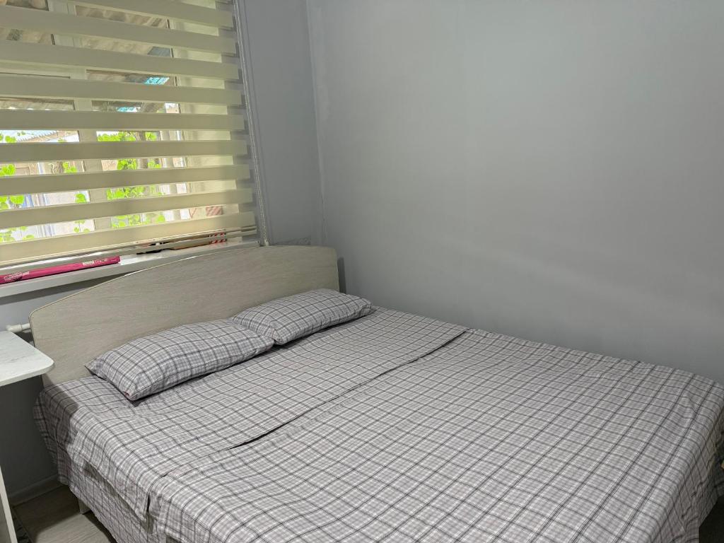 Postel nebo postele na pokoji v ubytování Nomads Home