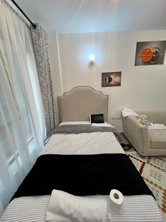 Postel nebo postele na pokoji v ubytování Tsavo Residence
