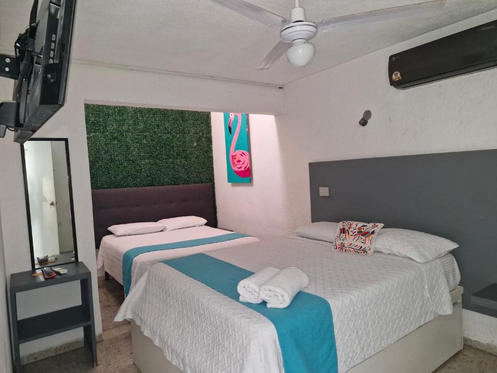 Postel nebo postele na pokoji v ubytování Hotel Downtown Merida