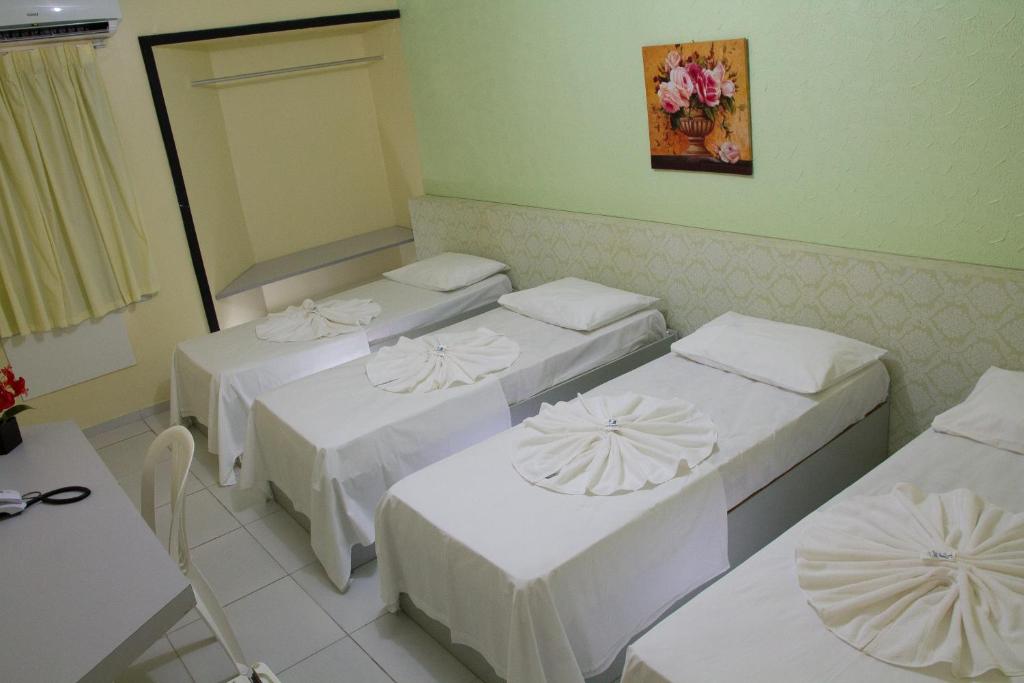 Cama ou camas em um quarto em JR Hotel