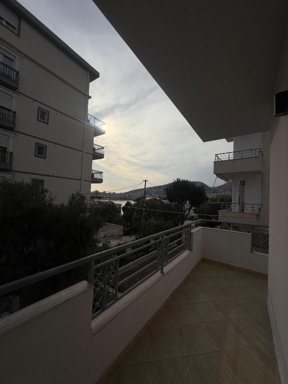 a balcony with a view of a building at Hotel Barjami in Sarandë