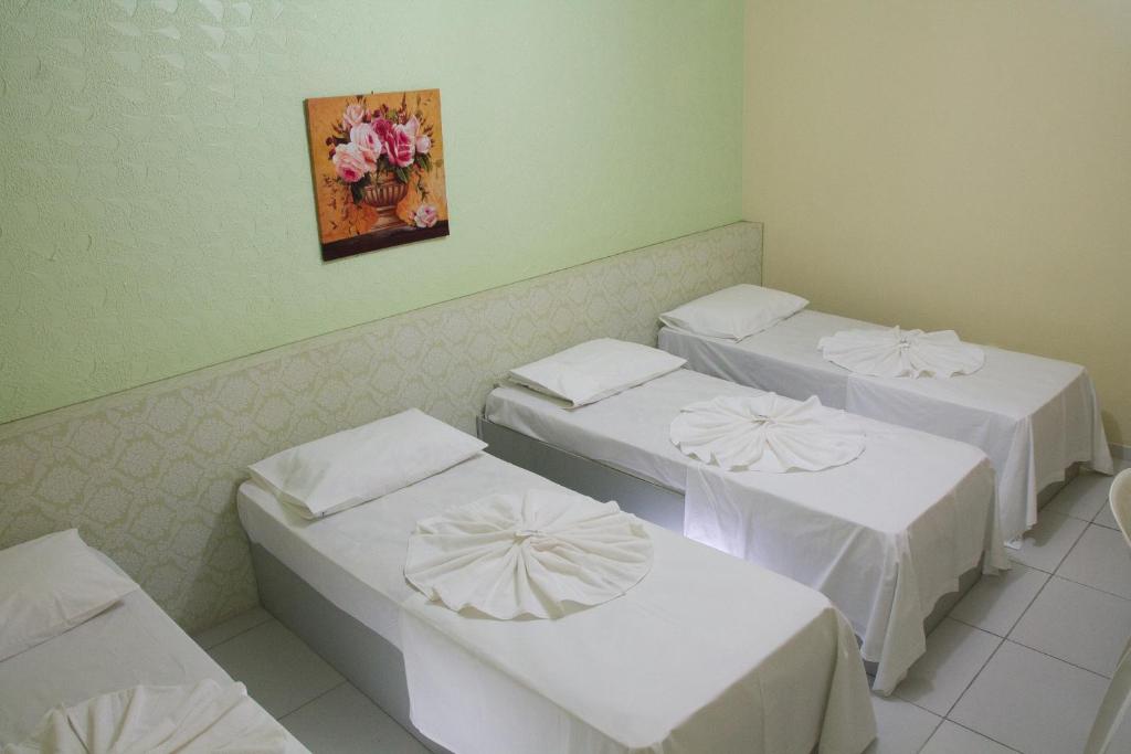 Cama ou camas em um quarto em JR Hotel