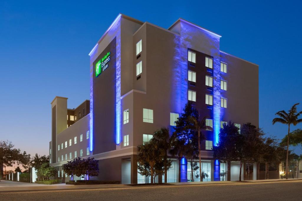 a building with blue lights on the side of it at Holiday Inn Express Fort Lauderdale Airport South by IHG in Dania Beach