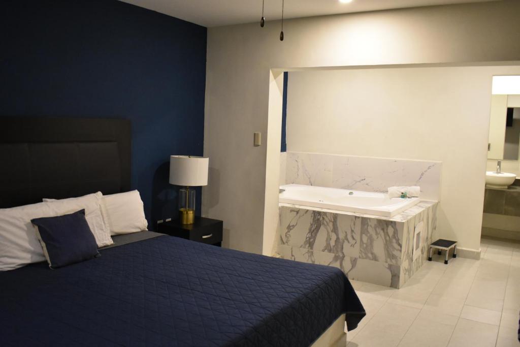 Postel nebo postele na pokoji v ubytování Hotel Casa 20