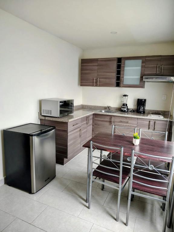 Kuchyň nebo kuchyňský kout v ubytování Hotel Casa 20