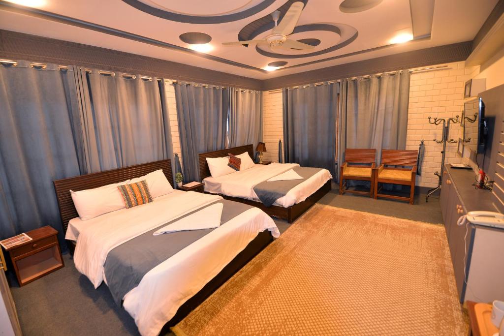 Posteľ alebo postele v izbe v ubytovaní Signature Skardu Hotel