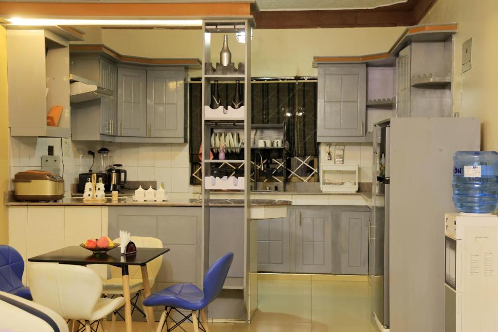 Kuchyň nebo kuchyňský kout v ubytování AG Home - Kampala