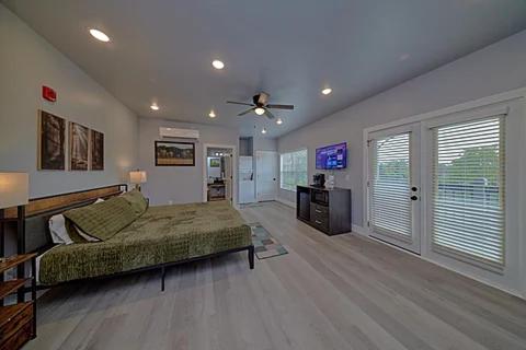 a large room with a bed and a tv in it at #6 Studio Town Place 2 in Sevierville