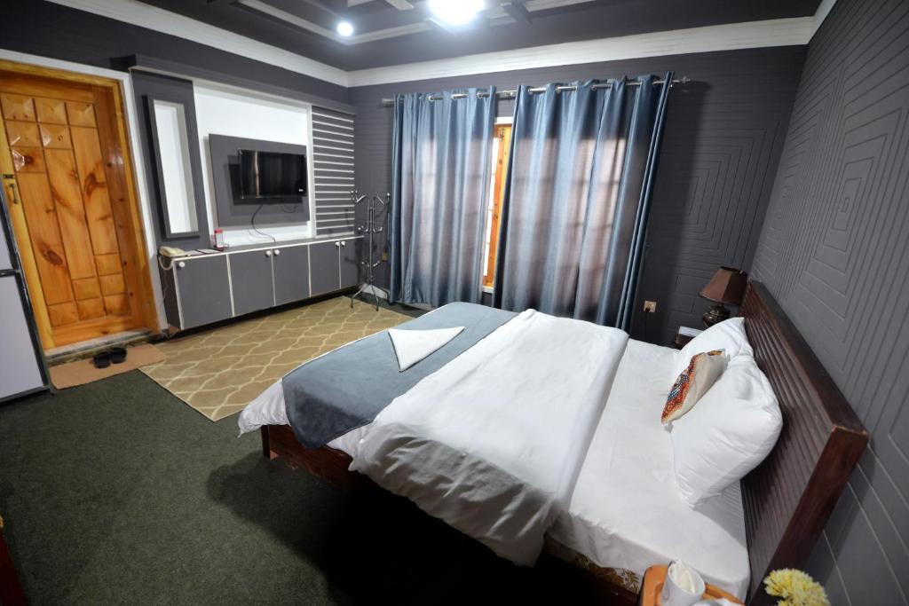 Posteľ alebo postele v izbe v ubytovaní Signature Skardu Hotel