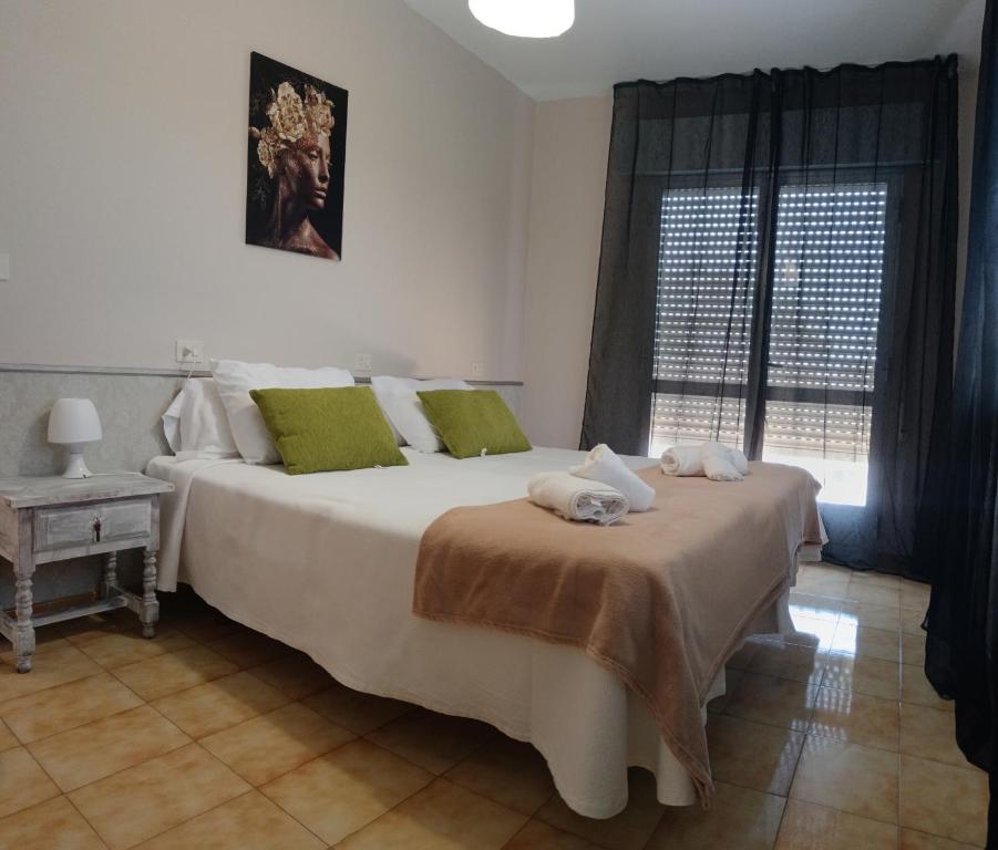 Postel nebo postele na pokoji v ubytování CASA PORTELA APARTAMENTOS