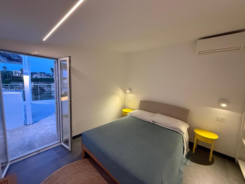 Postel nebo postele na pokoji v ubytování Buona Onda Apartments