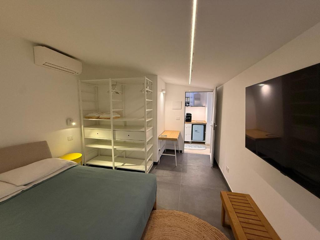 Postel nebo postele na pokoji v ubytování Buona Onda Apartments
