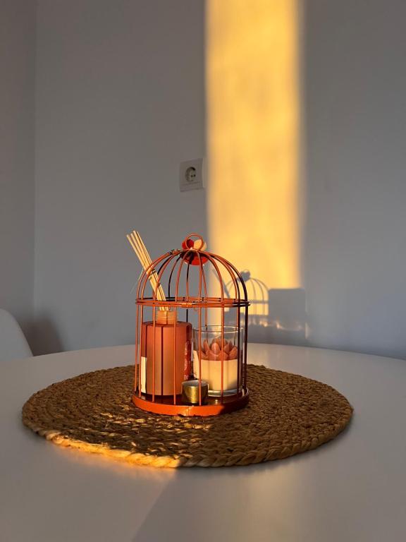 a bird cage sitting on top of a table at Apartmani Gazivode in Budva