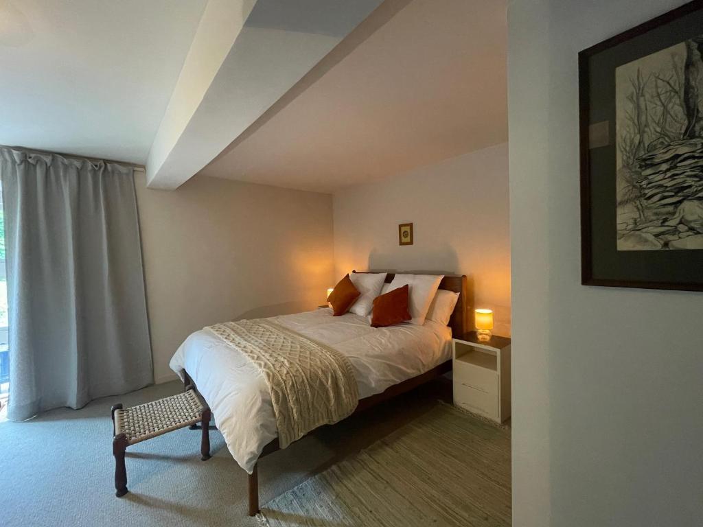 a bedroom with a bed and a window at The Barns Low Stott Park near Lake Windermere in Ulverston