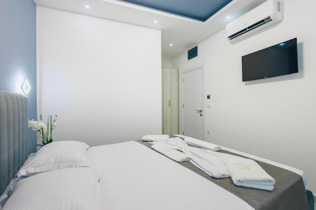 Postel nebo postele na pokoji v ubytování Apart-Hotel President