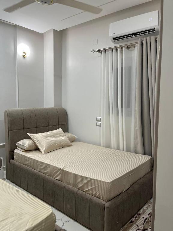 Postel nebo postele na pokoji v ubytování Eshyan Guest House