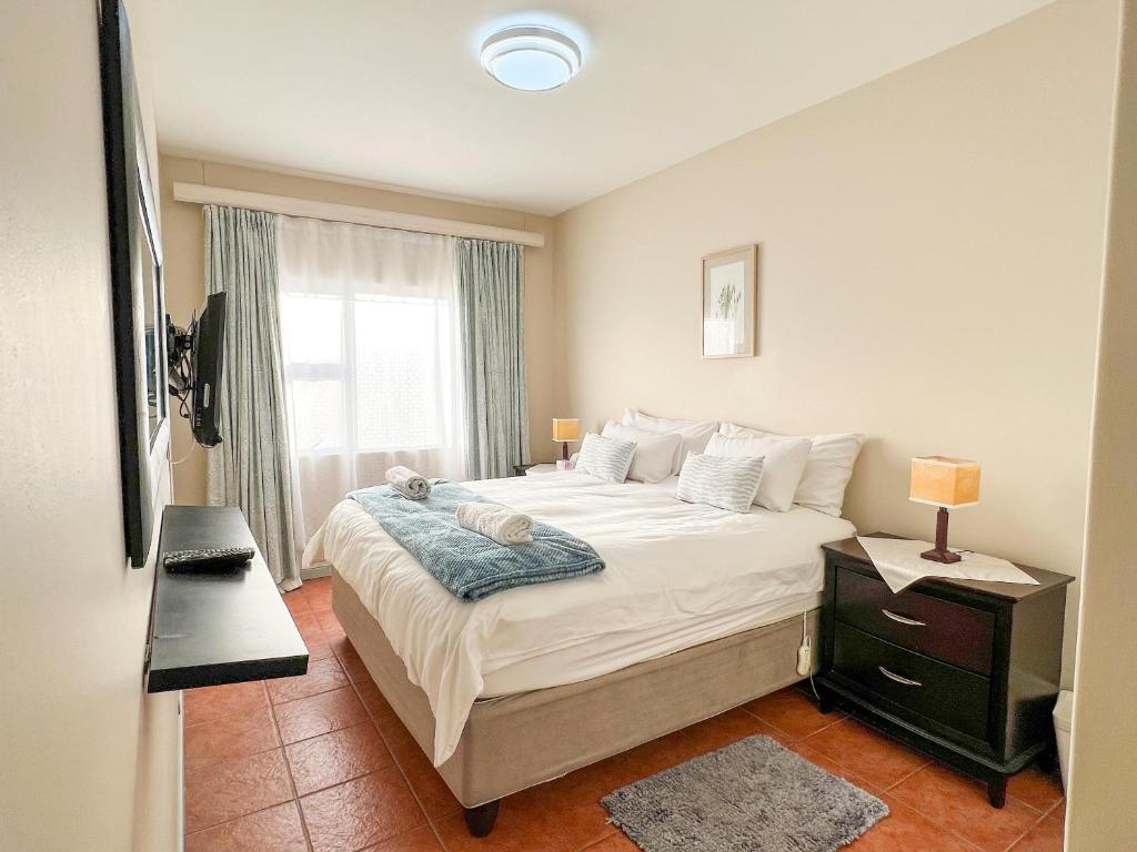 Ένα ή περισσότερα κρεβάτια σε δωμάτιο στο ProAvia Apartments and Hotel-Long Beach