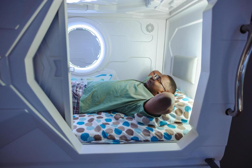 Postel nebo postele na pokoji v ubytování Belgrade Beocean Capsule Hostel