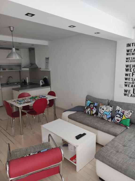 a living room with a couch and a table at Apartman Doma in Livno