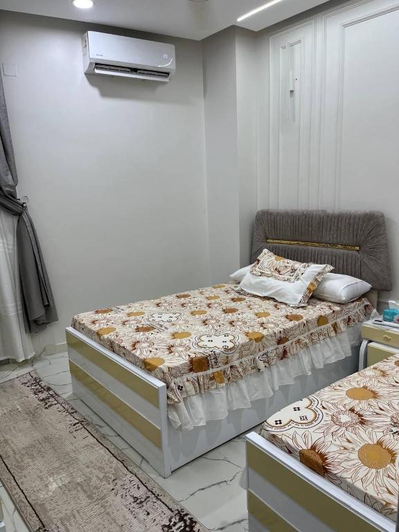 Postel nebo postele na pokoji v ubytování Eshyan Guest House