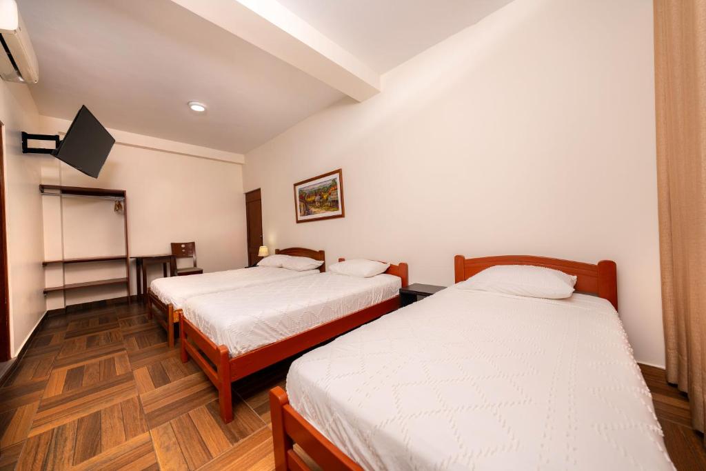 Postel nebo postele na pokoji v ubytování Paraiso Wasi