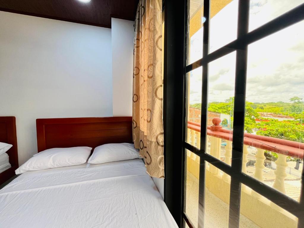 Postel nebo postele na pokoji v ubytování Aparta Hotel Horinthia